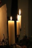 Christmas Lights, three burning White Stearic candles