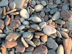round stones on the beach under daylight