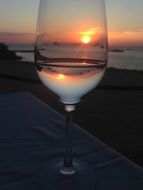 sunset through wine glass