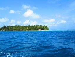 photo of green island in the ocean in Indonesia