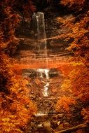 waterfall among autumn trees in michigan