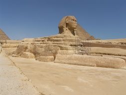 distant view of the Sphinx on the background of the pyramids