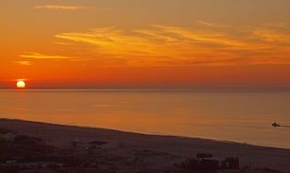 distant sunset on the coast of portugal