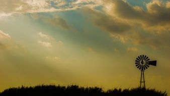 windmill on the field at dusk