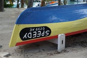 bright boat on the caribbean beach