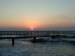 sunset over the pier in Esentepe