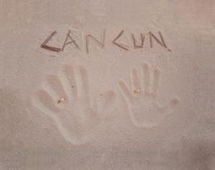 handprints and the inscription in the sand