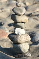 stones sculpture on the sandy beach