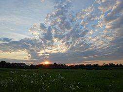 landscape of scenic clouds above countryside at summer sunset in Poland in krakÃ³w