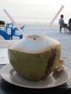 cocktail in a coconut on the beach in Langkawi
