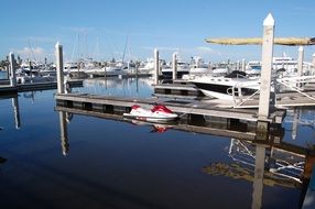 many boats in the harbor on a sunny day