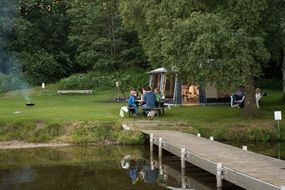 people on a picnic near the tent
