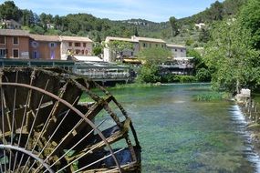 dilapidated water wheel on the river