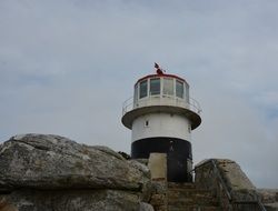 lighthouse on a rock on a cape of good hope