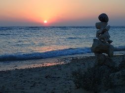 Meditation on a beach at the sunset