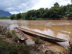 wooden boats ashore in Laos, Asia