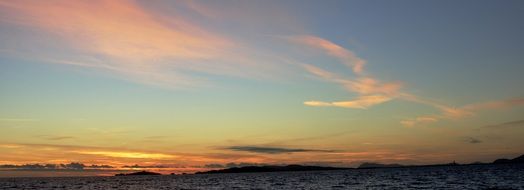 red-orange sky at dusk over seascape