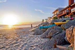 boats on the beach near the stones