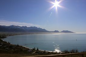 bright sun over the coast of new zealand