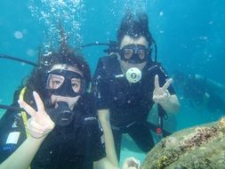 happy divers underwater, malaysia