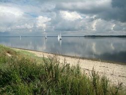 distant view of sailboats off the coast of denmark