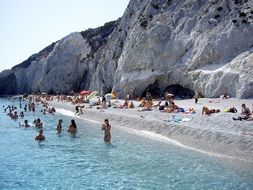 vacationers on the coast of the island of skiathos