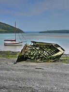 abandoned broken boat on the beach