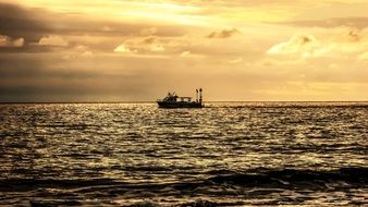 boat in the sea at sunset
