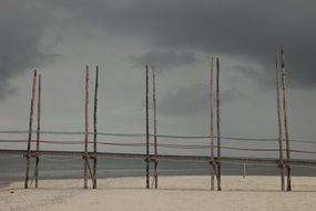 weathered wooden pier on coast of North Sea