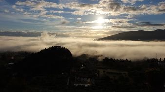panoramic view of the valley in the fog at sunset