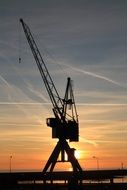 silhouette of a harbor crane in the city of harlingen