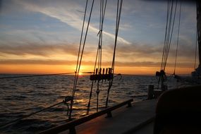 sailboat on water during sunset