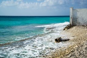 pebble coast near the bright turquoise surf