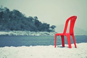 red chair by the river