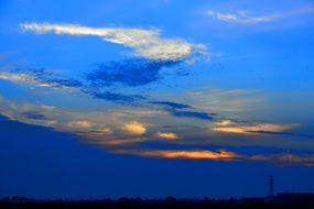 evening sky in clouds over a red beach