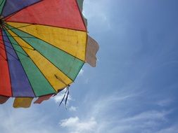 multicolored beach umbrella against the sky