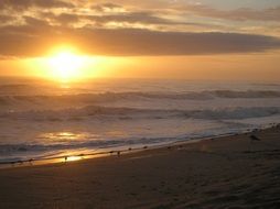 sunrise over the sea and the beach