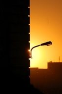 silhouette of a street lamp at sunset