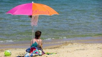 Colorful Umbrella on a sand beach