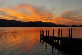 orange sunset over a quiet lake