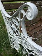 white metal armrest of bench