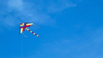 Colorful kite in the beautiful blue sky