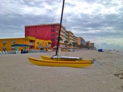 yellow boat on a sandy beach in florida