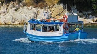 blue touristic boat in Greece