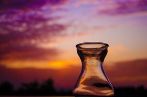 bottle on a background of colorful sunset