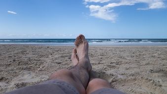 feet on a sandy beach close-up