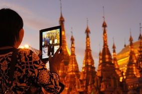 taking picture woman of Shwedagon pagoda