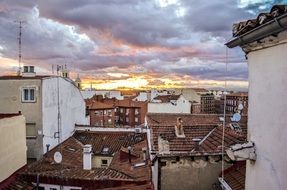 evening sky in the clouds over the rooftops of madrid