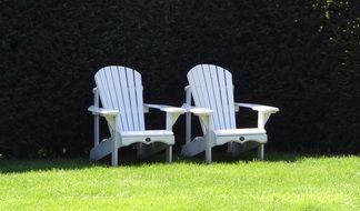 white chairs in a green meadow