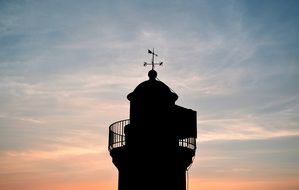 dark silhouette of the lighthouse at Finisterre, France